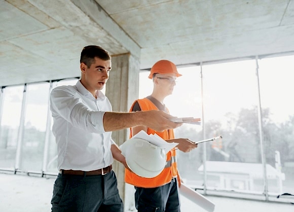planning the process man in suit and handyman